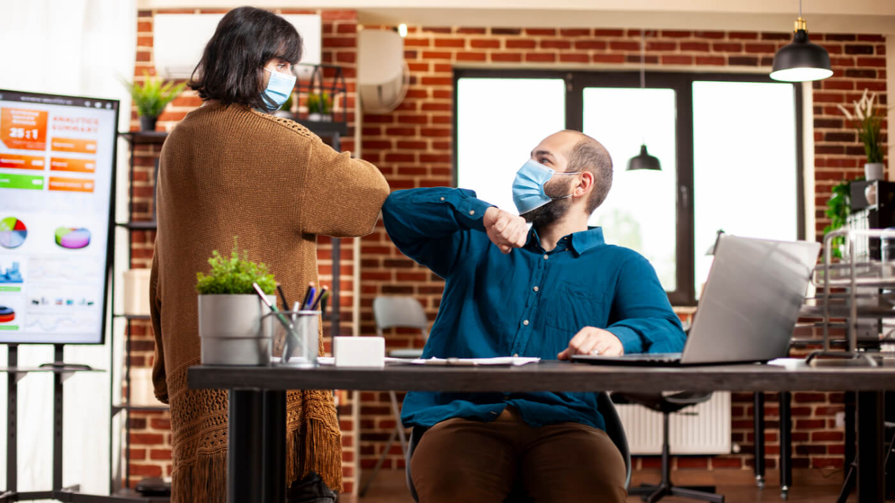 coworkers-ensure-safe-greeting-office (1) (1) coworkers-ensure-safe-greeting-office (1) (1)