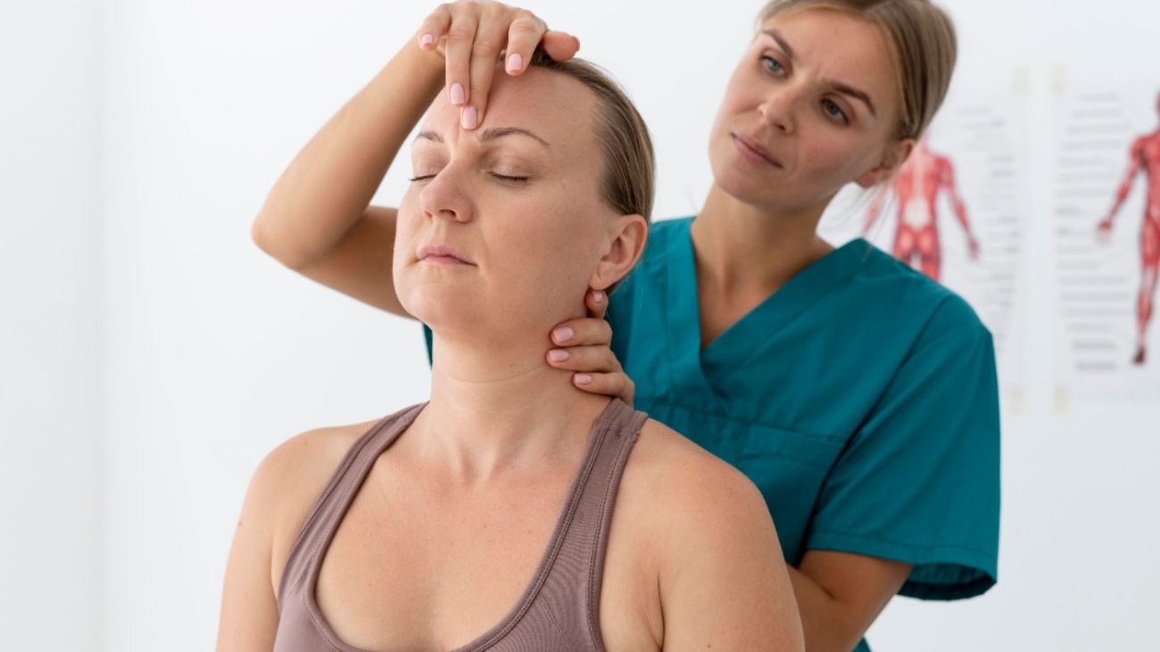 physiotherapist-helping-patient-her-clinic_edited