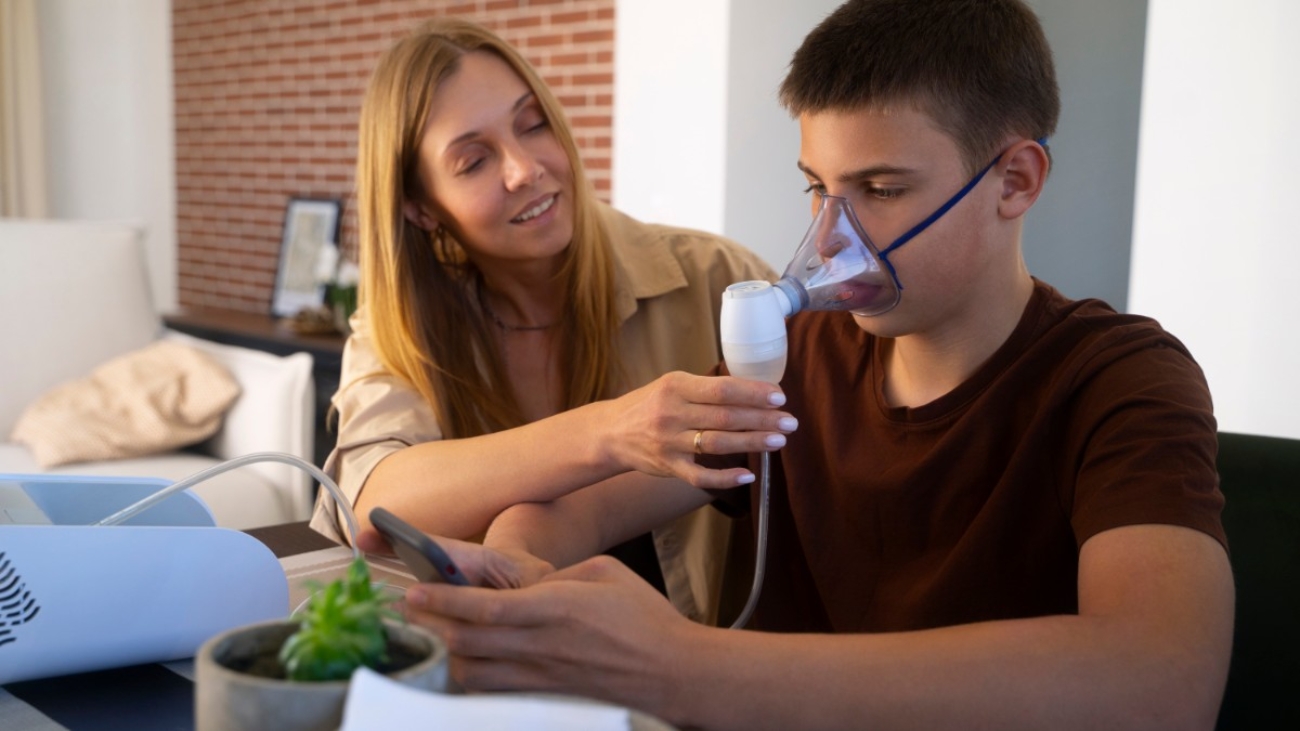 view-teenage-boy-using-nebulizer-home-respiratory-health-problems_edited view-teenage-boy-using-nebulizer-home-respiratory-health-problems_edited
